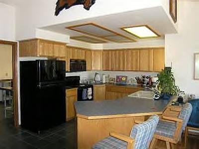 Breakfast bar at the updated kitchen fills with natural light.