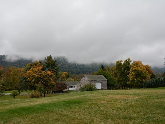Back view of mountain and barn