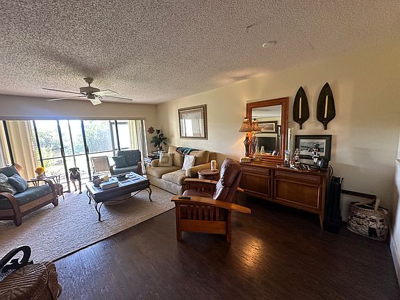 Spacious living area with Bernhardt couch and Lazyboy recliner overlooking watrfront view. Would consider unfurnished rental.