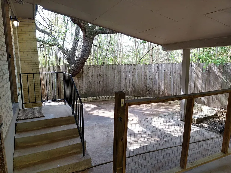 Paved private side yard perfect for entertainment.