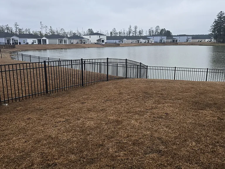 Yard is completely fenced- sides and lake front
