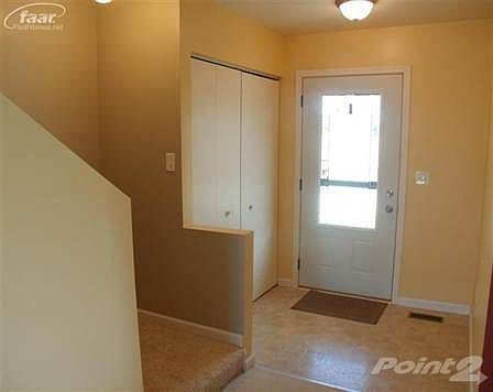 Entryway with closet.
