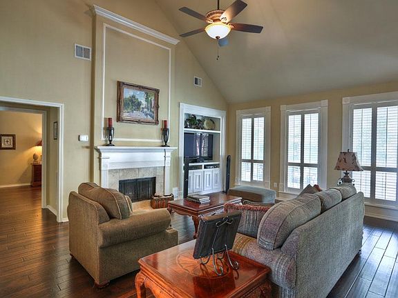 Natural light streams into the FAMILY/LIVING ROOM 23x15. An 18' cathedral ceiling compliments the fireplace wall with gas-wood burning fireplace sided by a built-in entertainment center. Use of wood flooring and custom millwork continues.