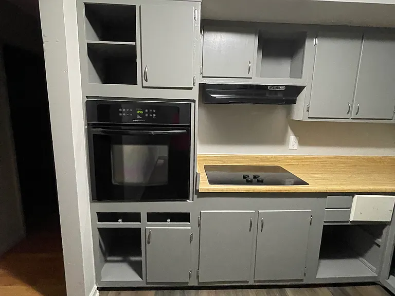 Painted cabinets, wall oven and Jenn aire glass Cook top