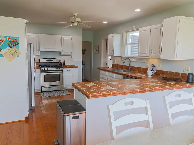 Fully stocked kitchen with gas oven and stove