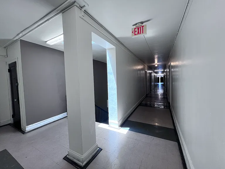 Down the hall you will find the fire escape.