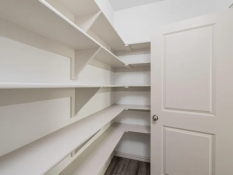 A spacious pantry on one side