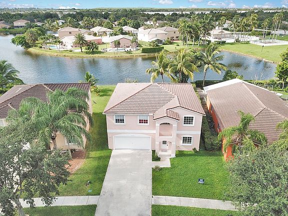 Front of house with lake vie