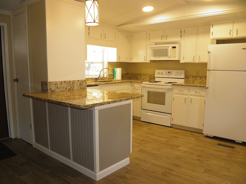 Renovated kitchen with kitchen island, newer appliances. Quiet Dishwasher. Island sized for 2 counter stools. ALL GRANITE counter. Granite counters, Soft Close kitchen 3 bank drawers, Large pantry and plenty of countertops.