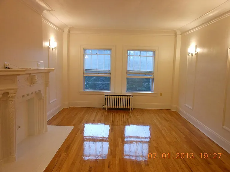 Living rooms, 9' tall ceilings, crown moldings, beautiful Oak floors and Fireplace.
