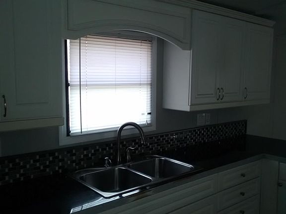 Kitchen large window, lots of custom cabinets