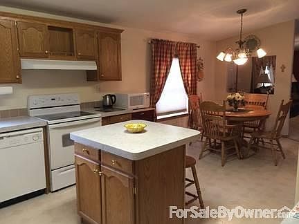 Open Kitchen
						:
						Offers great built in china cabinets and an island!