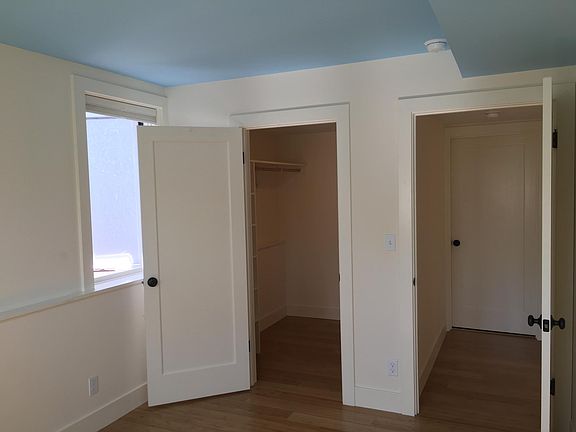 bedroom, looking east. welk-in closet on left, hall to bathroom on right.