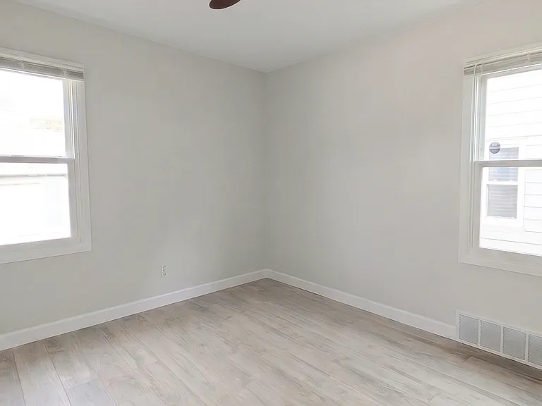 Bedroom #2 also with ceiling fan, lots of nice daylight, and good closet size