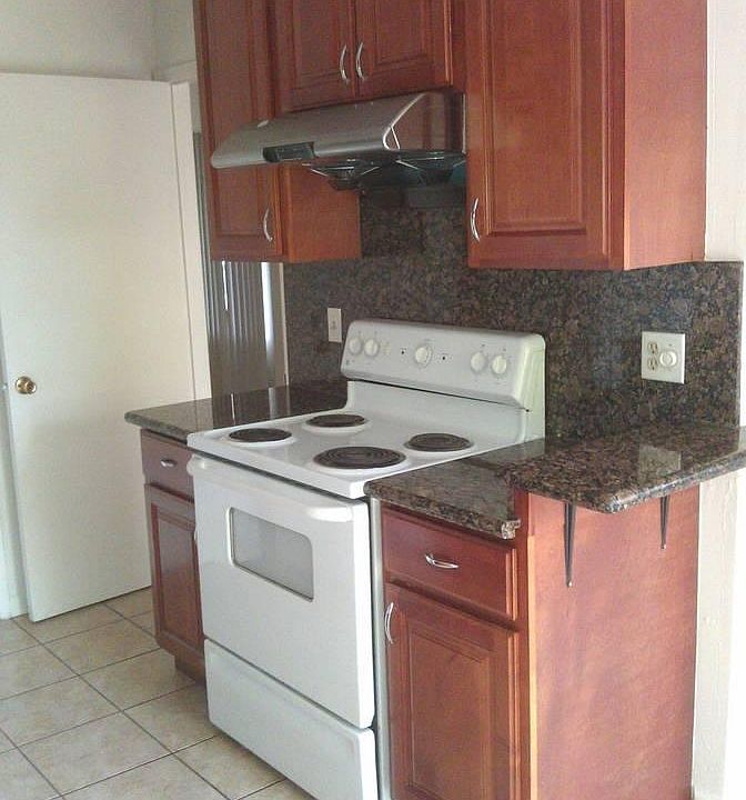 Kitchen with granite and tile floor