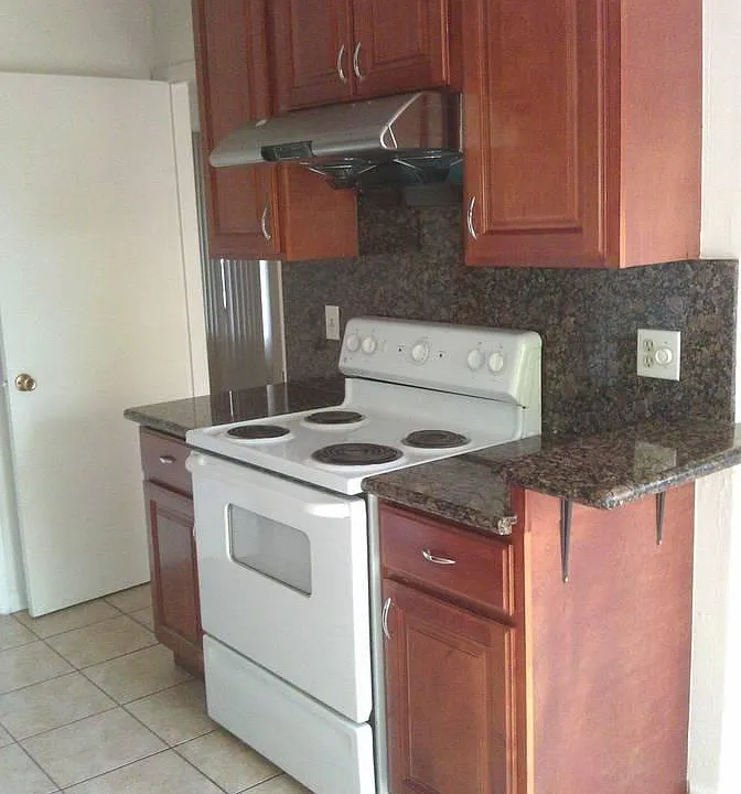 Kitchen with granite and tile floor