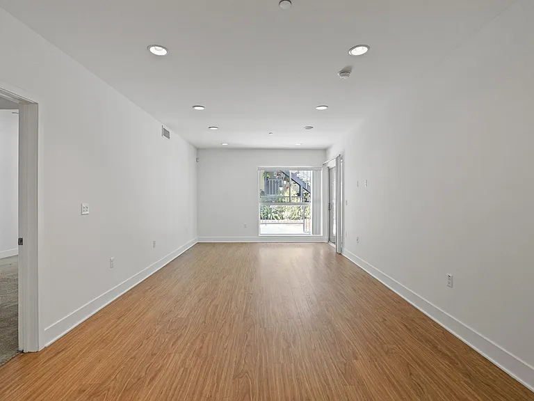Large Living Room Space with Vinyl Flooring and Recess Lighting
