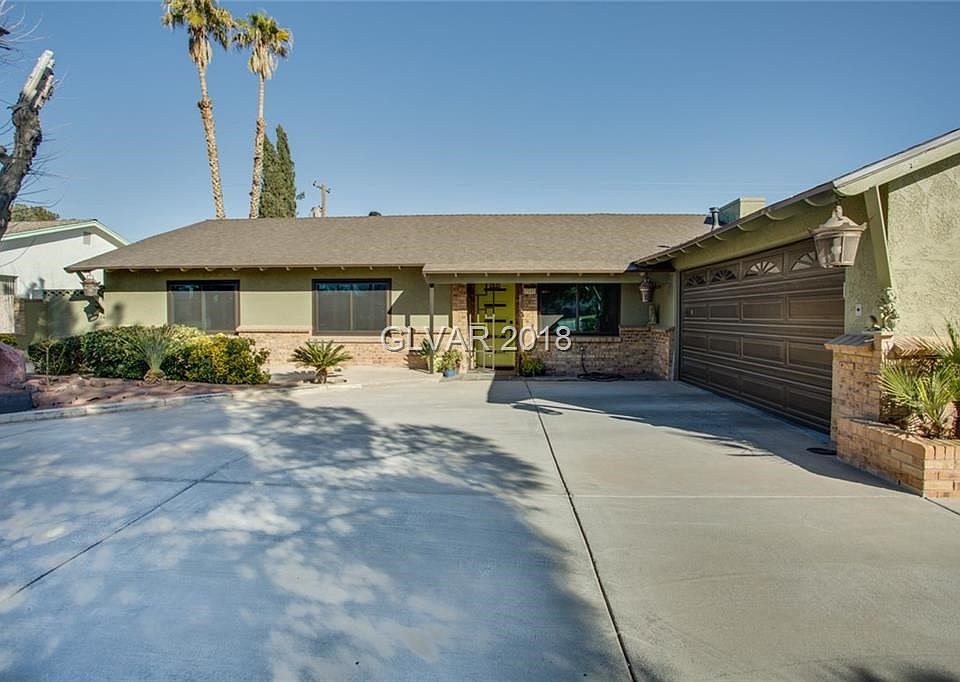Exterior front with circular driveway.  Home has new composite shingle roof.