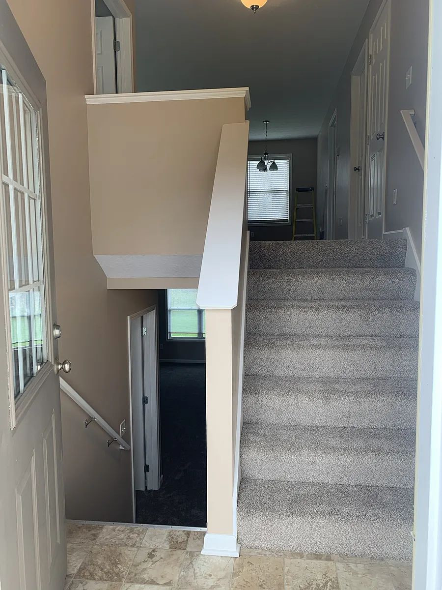 Photo 2 of 18 - 4673 S Shooks Ct - Hudsonville, MI Front entry of duplex 6 steps up and 6 steps down - 4673 S Shooks Ct