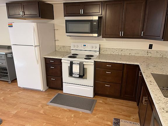 New Cabinets, Quartz countertops new built-in microwave.
