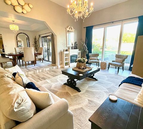 Gorgeous formal living room as you enter the home. This space includes large 60-inch smart TV, & an electric fireplace. The primary en-suite aka bedroom #1 is to the right as you enter the into the foyer