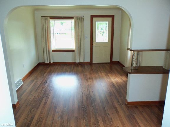 Living Room & Dining Room featuring newer laminate flooring.