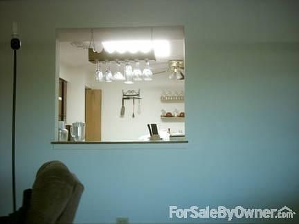 Dinning/ Kitchen View
						:
						Partition between Dining Room and Kitchen with view of sun light in kitchen.