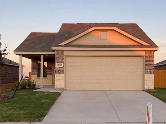 Front view - Porch and 2 car garage