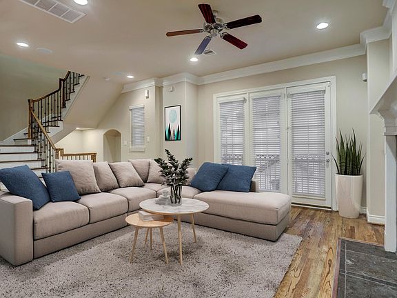 Spacious living room with Fireplace, area for bar, area to mount TV over fireplace and Juliet balcony overlooking outdoors.