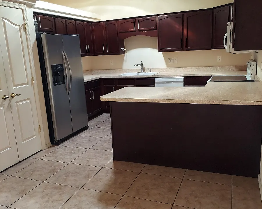 View into kitchen from Dining room
Pantry next to Refrigerator