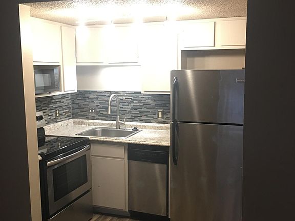Kitchen area: Includes full sized range/oven, small but very spacious dishwasher, microwave, and refrigerator.