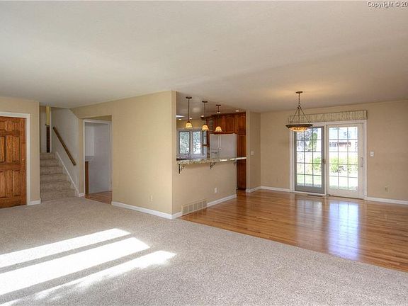 Easy access to the upper level, kitchen or out to the patio