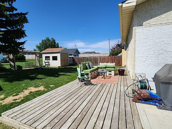 View to west, ground-level deck.
(Large shed and deck furniture not available)