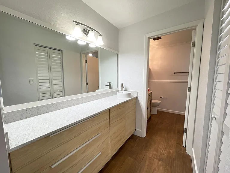 Master Bedroom Built in cabinetry with quartz countertop including dresser and 2nd sink.