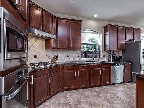 Kitchen with Stainless Steel Appliances and lots of cabinet space and large countertops