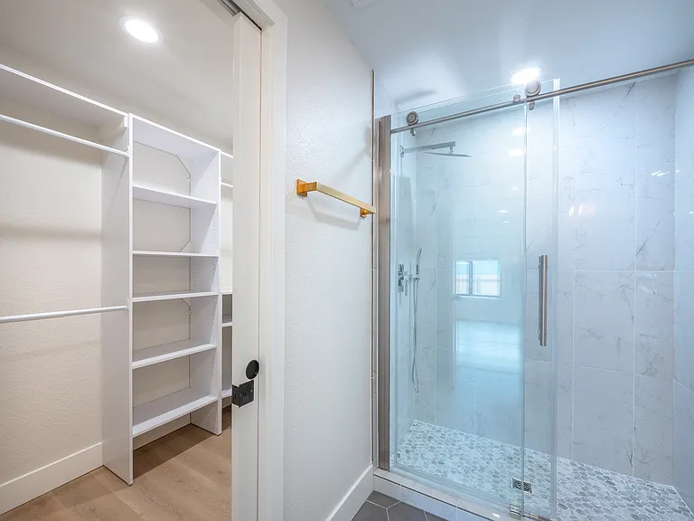 primary bathroom and walk in closet