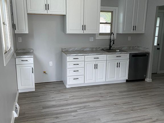 Beautiful remodeled kitchen with stainless steel Kitchen Aid dishwasher