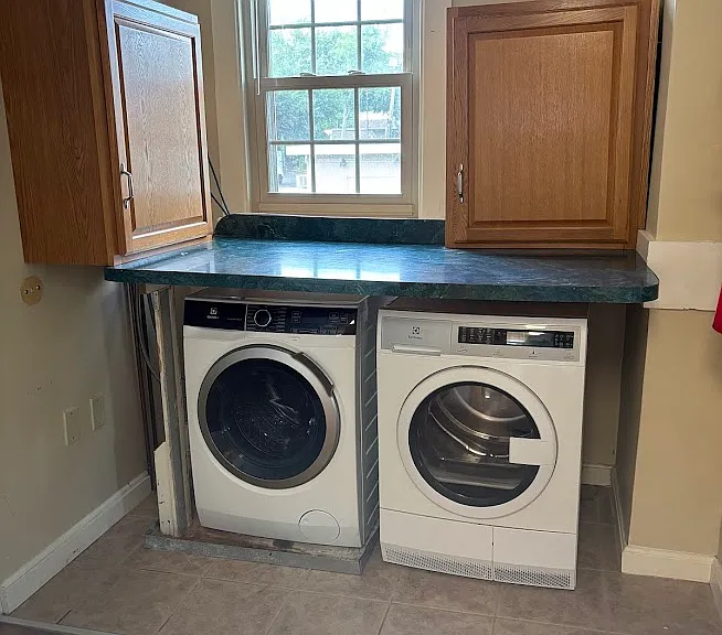 Washer & Dryer installed in unit.