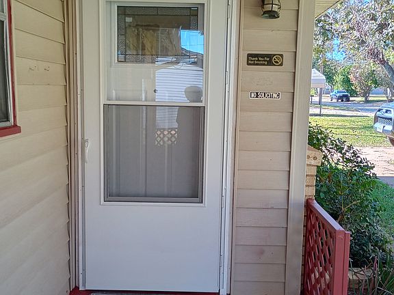 Front entry with screen door. Perp hole in door for security