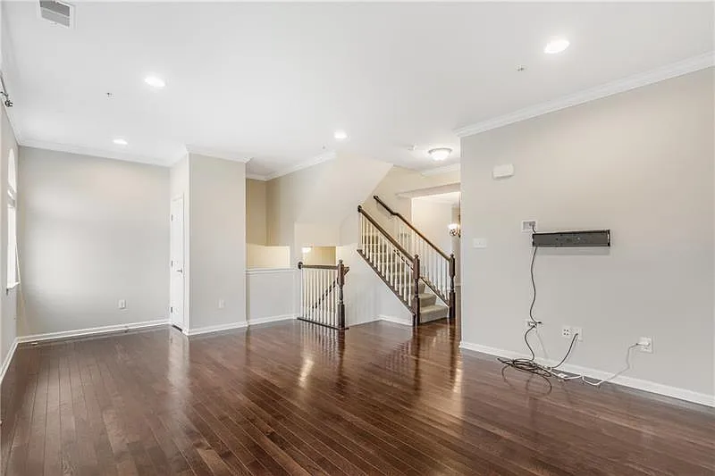 Large Family room with hardwood floors and TV wall mount installed - 248 Broadstone Dr