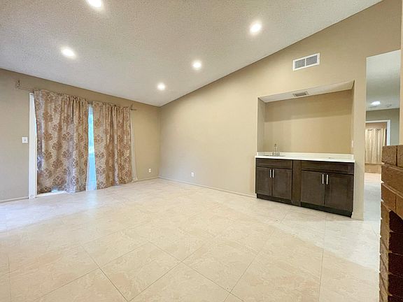 Family room with fireplace and wet bar