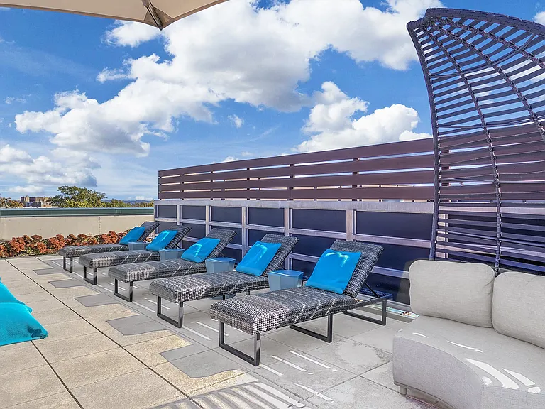 Rooftop sundeck with grilling stations and seating