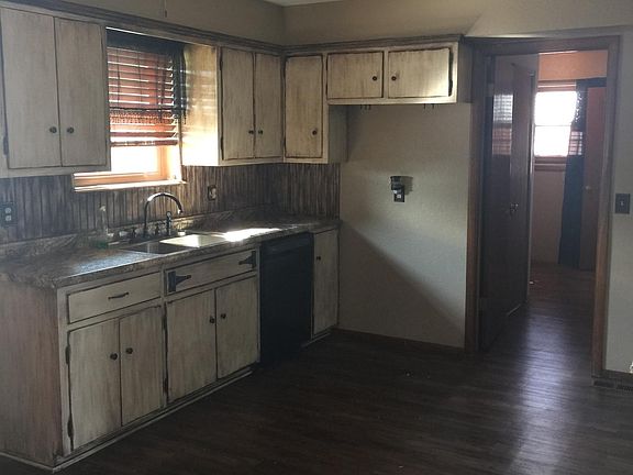 Kitchen new flooring and painted cabinets & updated counter 