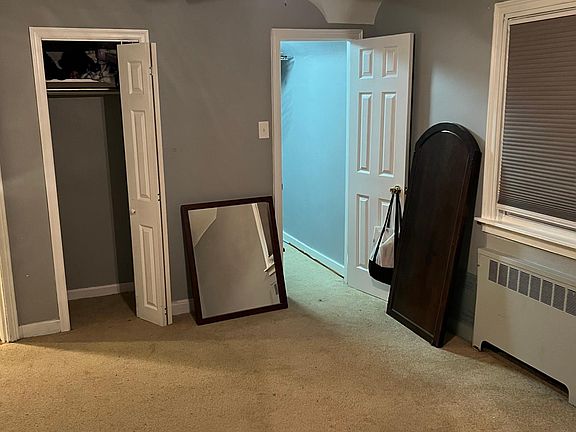 One of three upstairs bedrooms (main room - closet view)