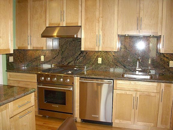New kitchen with pro style SS gas range, d/w, vent, frig