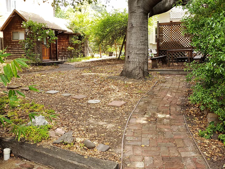 Backyard with the cabin and the cottage.