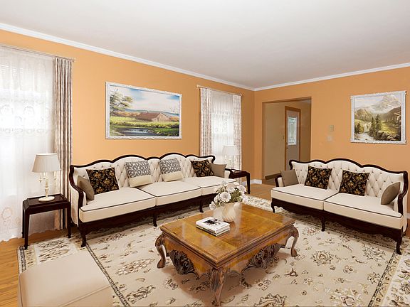 Living room. Room is virtually staged.