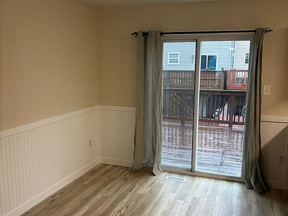 Dining room with bead board. New paint and flooring.