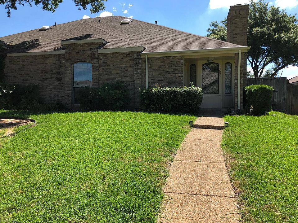 front lawn with sprinklers and yard service