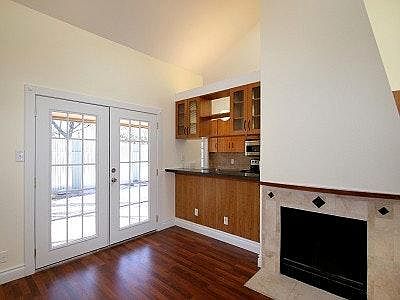 Looking from main living area through French patio doors to back yard